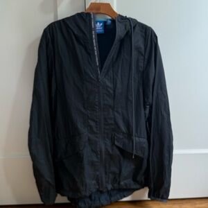 Adidas Men's Navy Hooded Jacket with printed trim, size small. Water resistant.